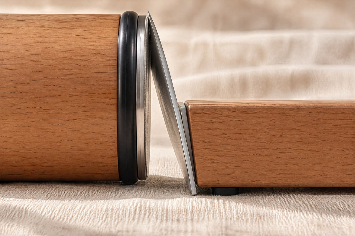 Side view: the flat diamond disc of the roller touches the edge of a knife held on the angle block